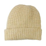 Beige knit beanie on a white background