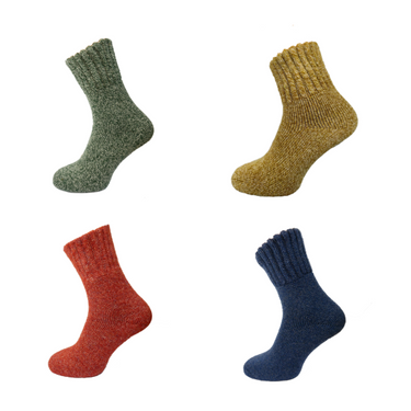 Four pairs of thick socks in green, mustard, rust, and blue on a white background.