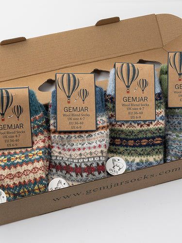 Set of patterned socks in a cardboard box with 'GEMJAR' branding.