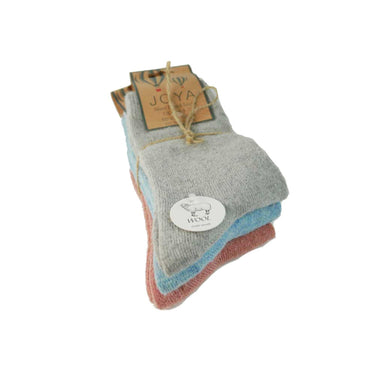 Set of three pairs of socks with a JOYA tag on a white background