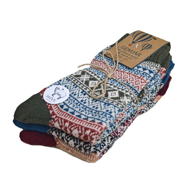 Stack of 3 fairisle patterned socks  on a white background