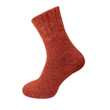 Red thick sock on a white background